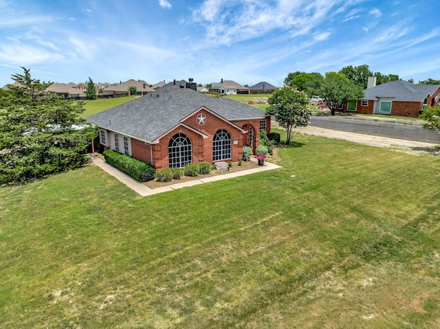 ranch-style home with a front yard