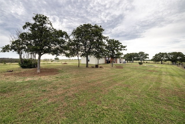 view of yard with a rural view