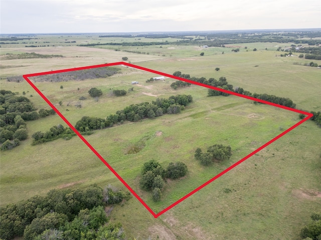 birds eye view of property with a rural view