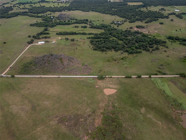 birds eye view of property featuring a rural view