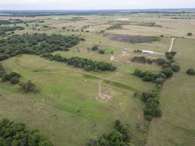 birds eye view of property with a rural view