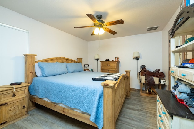 bedroom featuring ceiling fan and light hardwood / wood-style flooring