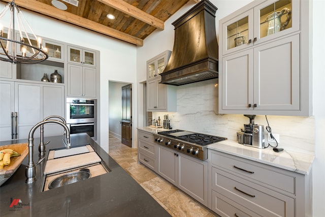 kitchen with beam ceiling, custom exhaust hood, appliances with stainless steel finishes, wooden ceiling, and decorative backsplash