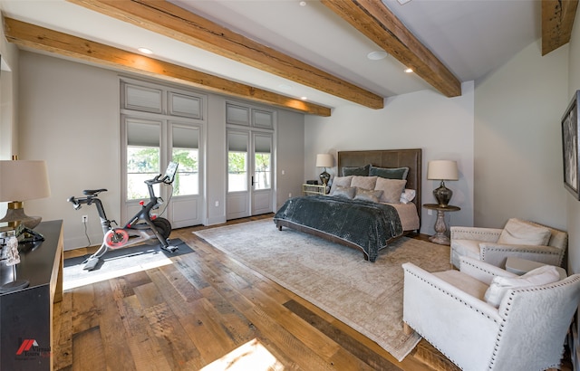 bedroom featuring access to outside, hardwood / wood-style flooring, and beam ceiling