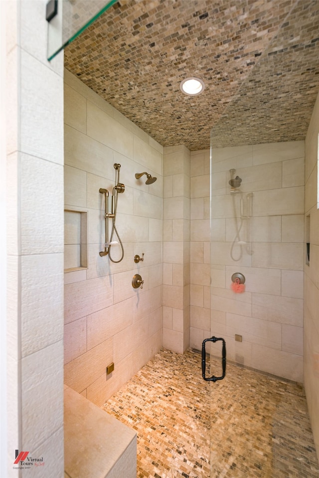 bathroom featuring tiled shower