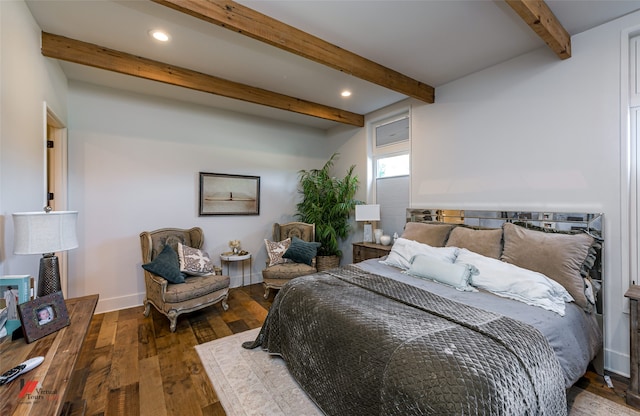 bedroom featuring beamed ceiling and dark hardwood / wood-style floors