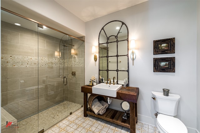 bathroom with walk in shower, tile patterned flooring, toilet, and sink