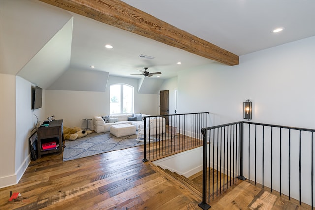 additional living space featuring vaulted ceiling with beams, ceiling fan, and wood-type flooring