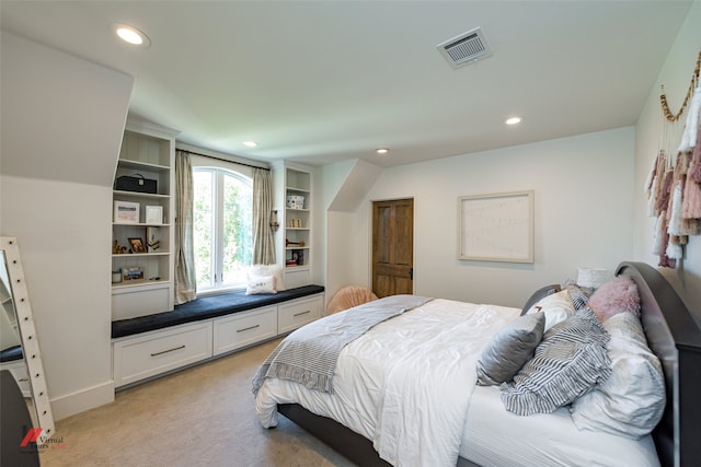 bedroom with light colored carpet