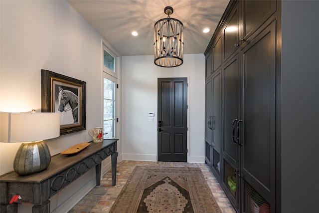 entryway featuring a chandelier