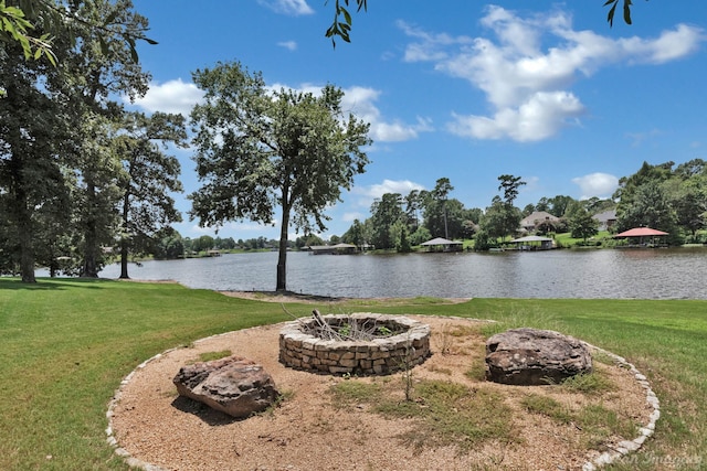 property view of water featuring a fire pit