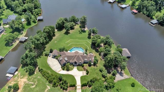 birds eye view of property with a water view