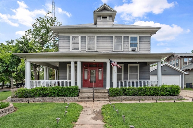 farmhouse featuring a garage, covered porch, and a front lawn