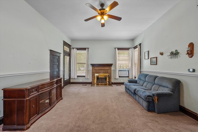 carpeted living room featuring a brick fireplace, ceiling fan, and cooling unit