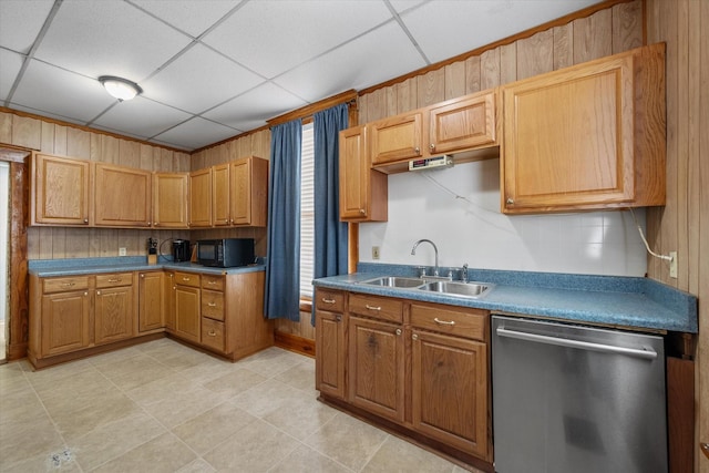 kitchen with dishwasher, a drop ceiling, and sink