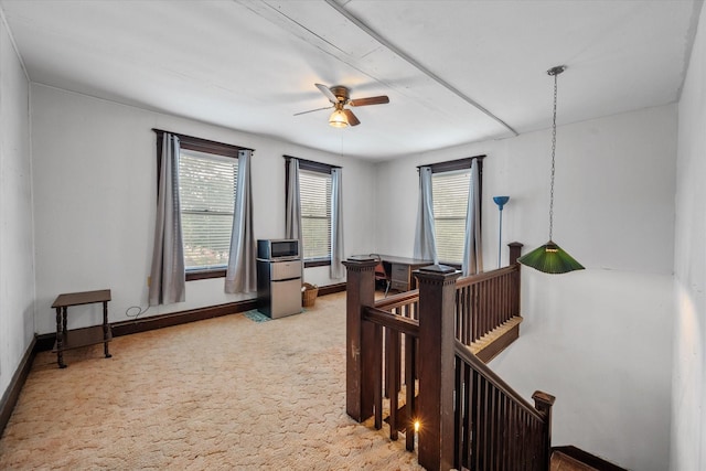 interior space with ceiling fan and plenty of natural light