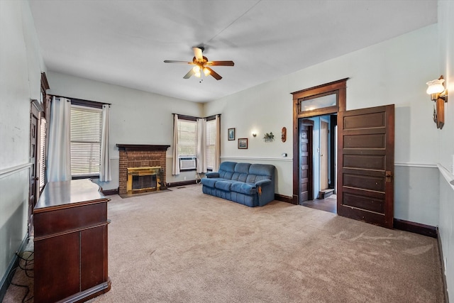 living room with carpet, ceiling fan, cooling unit, and a brick fireplace