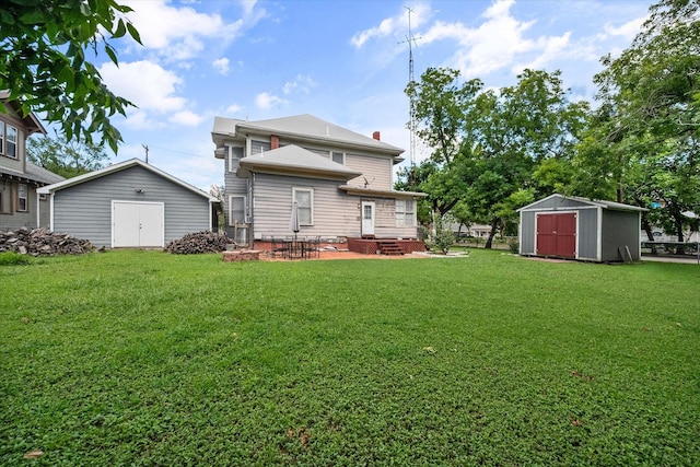 back of house with a storage unit, a yard, and a patio