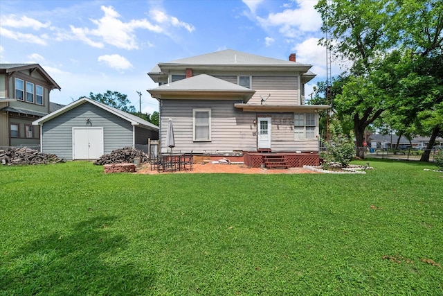 back of house with a yard