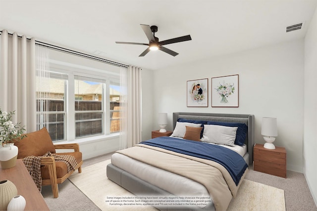 carpeted bedroom featuring ceiling fan