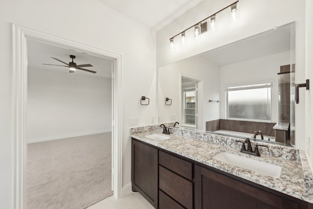 bathroom featuring ceiling fan and vanity