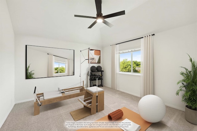 interior space featuring a healthy amount of sunlight, ceiling fan, and light carpet