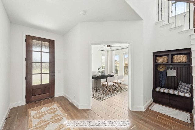 entrance foyer with ceiling fan and hardwood / wood-style flooring