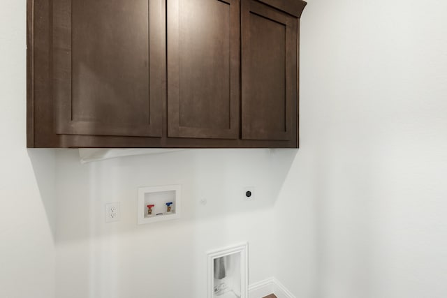 washroom featuring hookup for a washing machine, cabinets, and electric dryer hookup