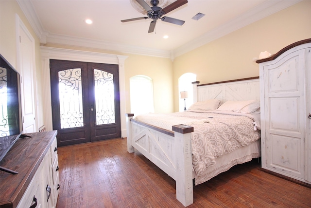 bedroom with dark hardwood / wood-style flooring, ornamental molding, ceiling fan, and french doors