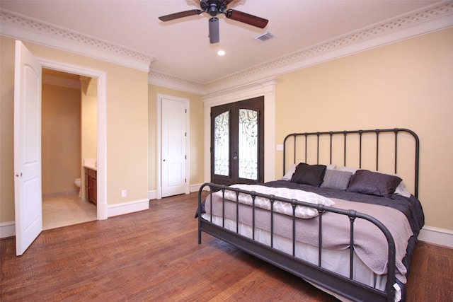 bedroom featuring ornamental molding, ceiling fan, ensuite bath, and dark hardwood / wood-style flooring