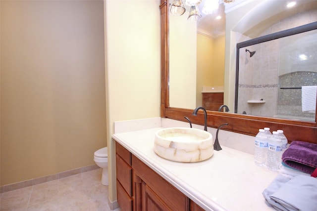 full bath featuring toilet, ornamental molding, tile patterned flooring, tiled shower, and vanity