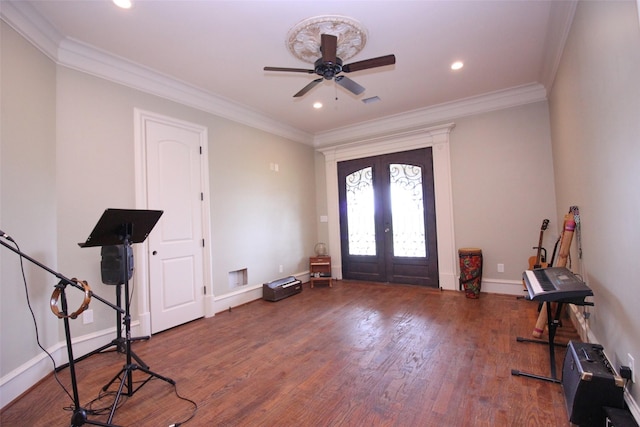 foyer entrance with hardwood / wood-style floors, recessed lighting, french doors, crown molding, and baseboards