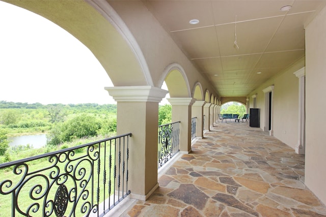 balcony featuring a water view