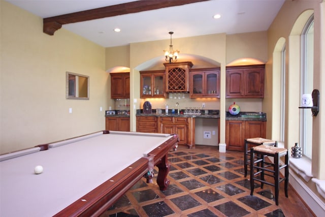 game room with indoor wet bar, beam ceiling, recessed lighting, and a sink