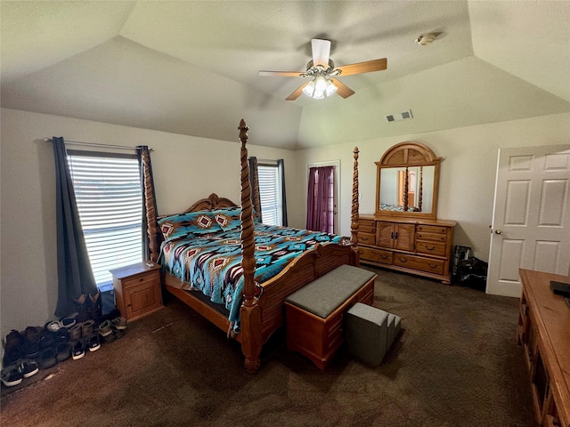 bedroom featuring ceiling fan, dark carpet, a raised ceiling, and lofted ceiling