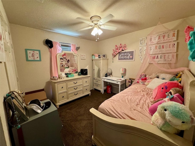 bedroom with ceiling fan, a textured ceiling, and dark colored carpet