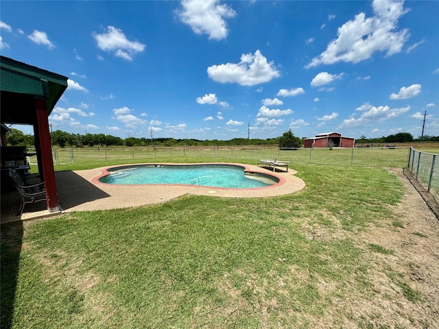 view of swimming pool featuring a lawn and a patio