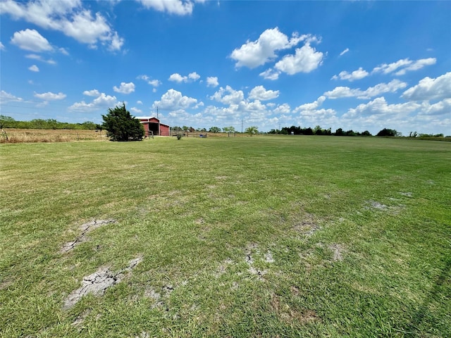 view of yard with a rural view