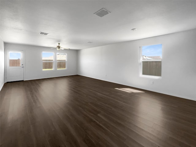 empty room featuring dark hardwood / wood-style flooring and ceiling fan