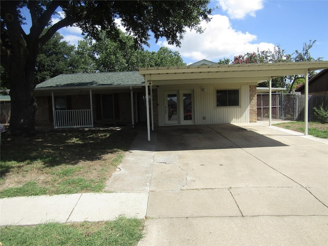 view of front of home featuring a carport