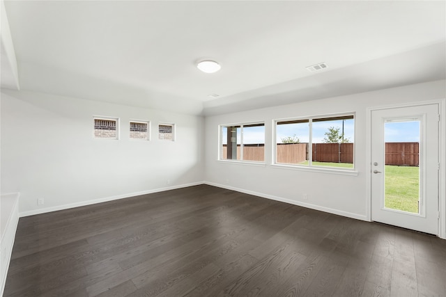 unfurnished room with dark hardwood / wood-style floors