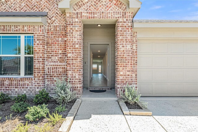 doorway to property featuring a garage