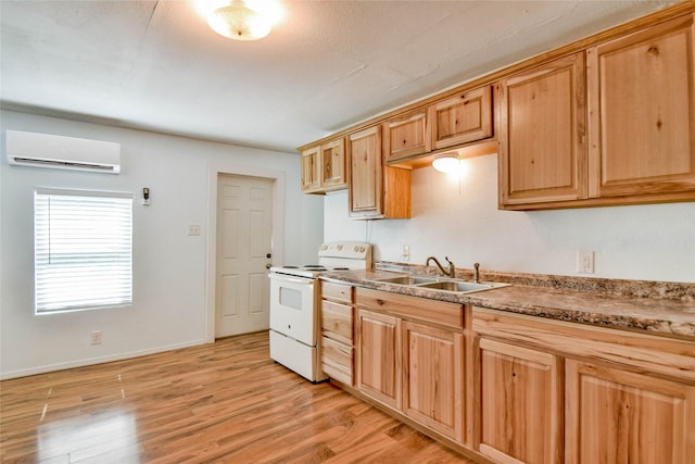 kitchen with light wood-type flooring, white electric range, sink, and a wall mounted AC