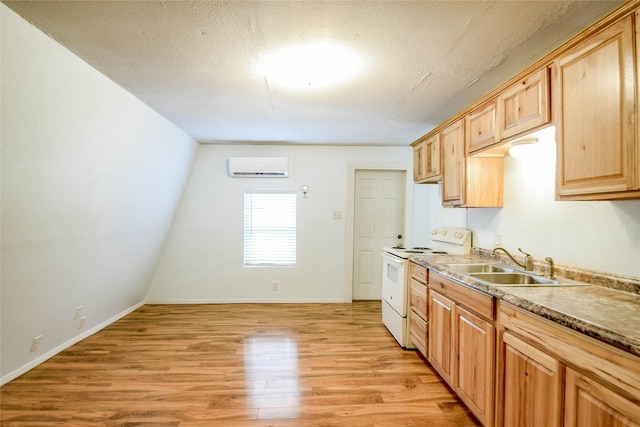 kitchen featuring a wall mounted air conditioner, sink, light hardwood / wood-style flooring, a textured ceiling, and white range with electric stovetop