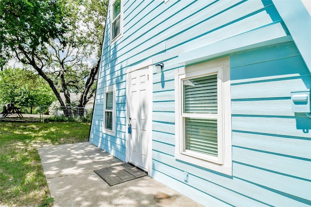 view of side of property with a yard