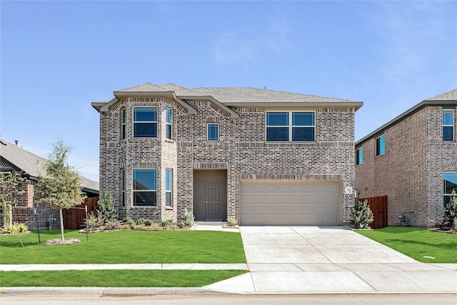 view of front of house featuring a front yard and a garage