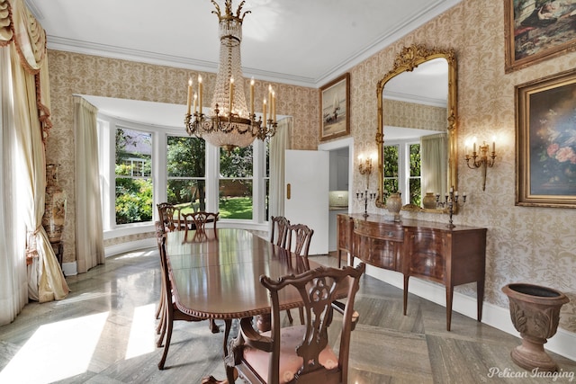 dining room with parquet floors, an inviting chandelier, and ornamental molding