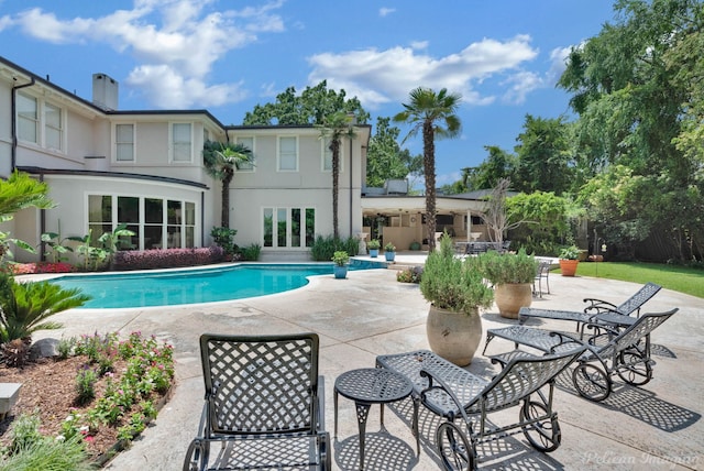 view of swimming pool with a patio area