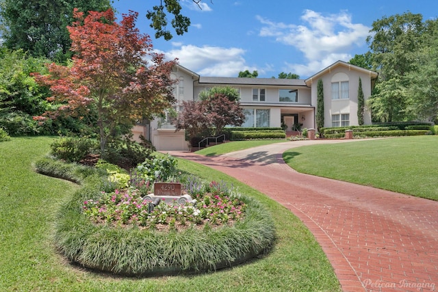 view of home's community with a yard