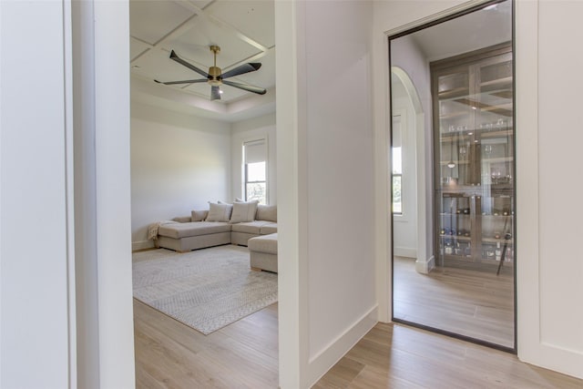 living room with ceiling fan and light wood-type flooring